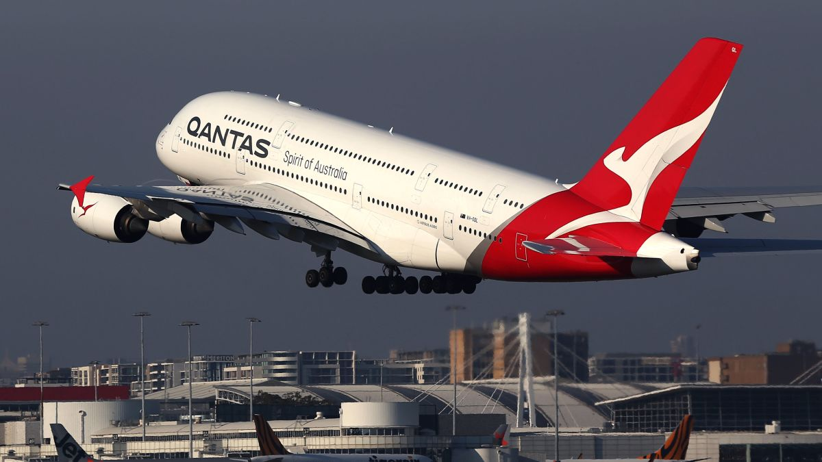 Qantas cuts almost a quarter of its flights over coronavirus fears - CNN