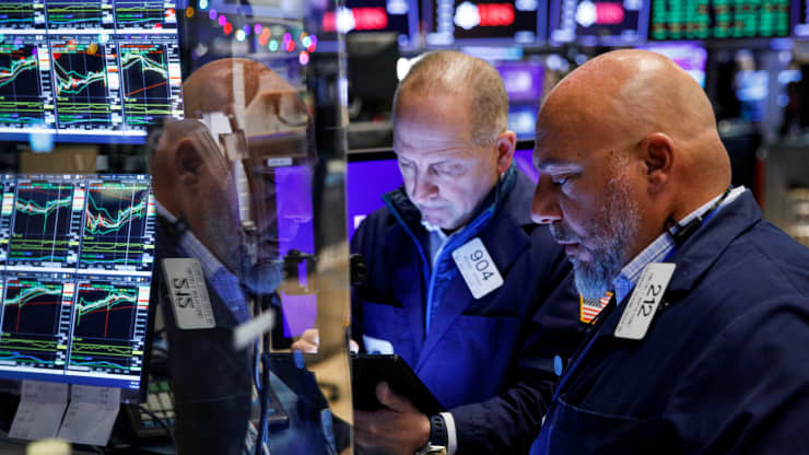 Traders work on the floor of the New York Stock Exchange (NYSE) in New York City, U.S., November 29, 2021.