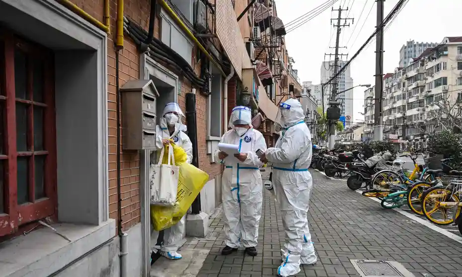 Shanghai begins locking down millions as China's Covid cases surge |  Coronavirus | The Guardian