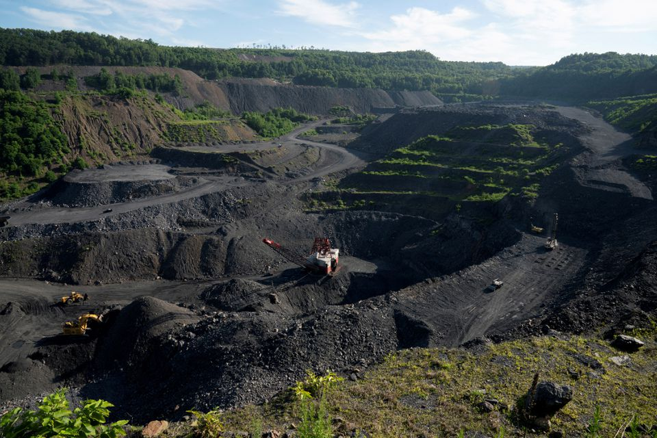 Heavy equipment excavate anthracite coal from a strip mine in New Castle, Pennsylvania