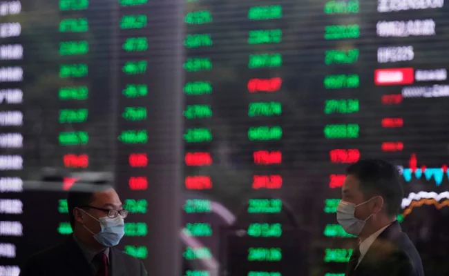 Asia Stocks Sink After US Bans Europe Travel Over Coronavirus