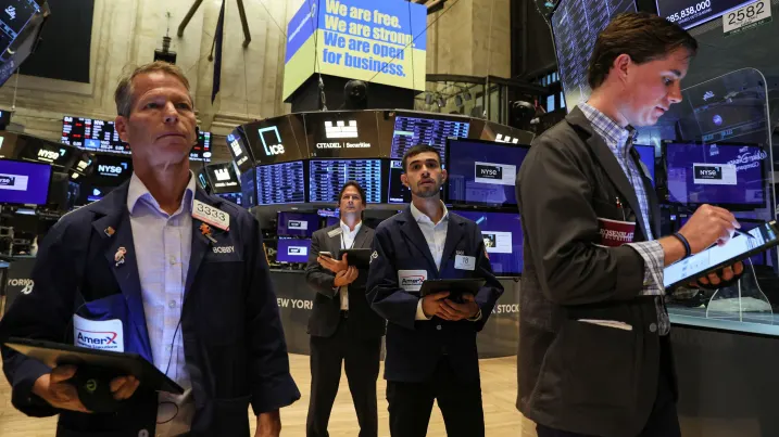 Traders watch as Ukraine's President Volodymyr Zelenskyy virtually rings the opening bell at the New York Stock Exchange (NYSE), to celebrate the launch of Advantage Ukraine, an initiative aimed at driving foreign direct investment in Ukraine, in New York City, September 6, 2022.