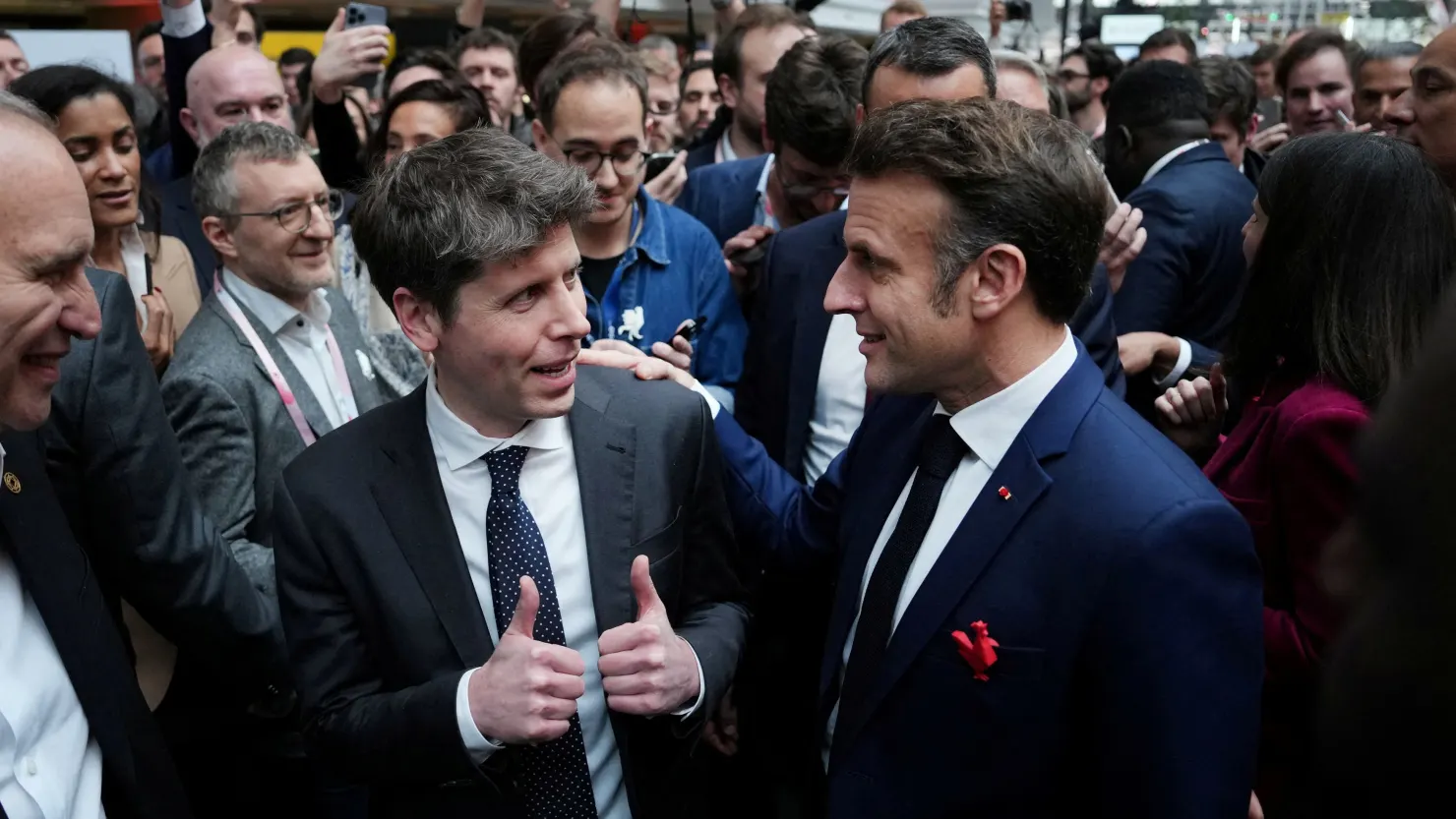 Sam Altman, CEO of OpenAI speaks with French President Emmanuel Macron at Station F, during an event on the sidelines of the Artificial Intelligence Action Summit in Paris, France, Feb. 11, 2025.     Aurelien Morissard/Pool via REUTERS