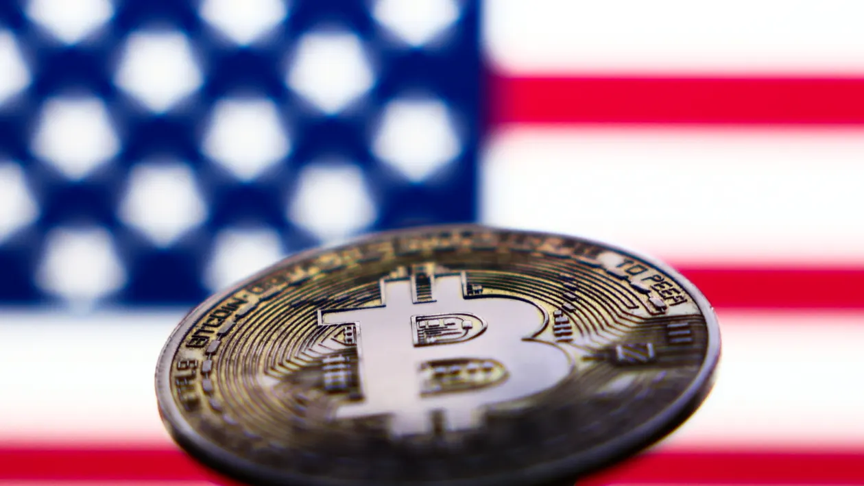 American flag displayed on a laptop screen and representation of Bitcoin cryptocurrency are seen in this illustration photo taken in Krakow, Poland on November 6, 2024. (Photo by Jakub Porzycki/NurPhoto via Getty Images)